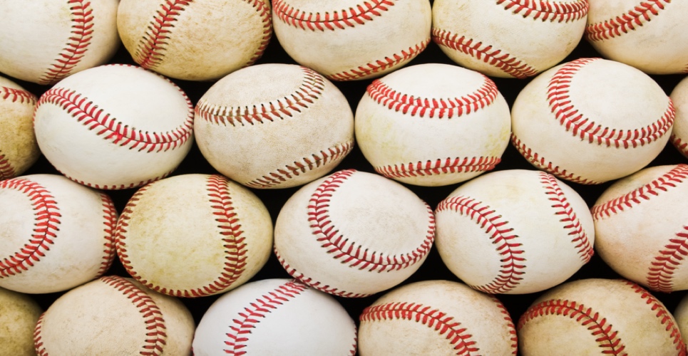 Several used, dirty baseballs