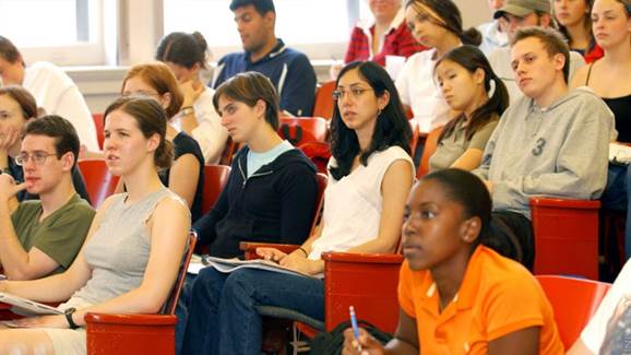 A group of people sitting in chairs

Description automatically generated with medium confidence